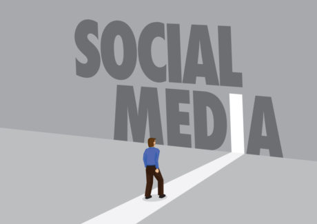 Person standing in front of social media banner